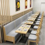 Custom restaurant booth seating and modern dining chairs for commercial hospitality project