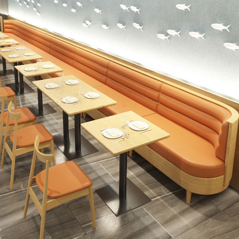 Custom orange upholstered restaurant banquette seating with wooden dining tables for cafe interior - Maylo Furniture