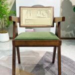 Modern rattan armchair with solid wood frame and green upholstered seat for hotel - Maylo Furniture