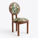 Modern wooden dining chair with circular backrest and floral fabric upholstery for restaurant seating - Maylo Furniture