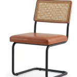 Modern dining chair with natural rattan backrest, brown upholstered seat, and black cantilever metal frame - Maylo Furniture