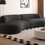 Modern dark grey curved sofa with minimalist design for contemporary living room decor - Maylo Furniture