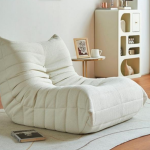 Modern white minimalist lounge chair with textured fabric, ideal for contemporary interior design - Maylo Furniture